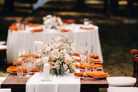 Wedding table decoration with flowers on the table in the castle, table decor Stock Photos