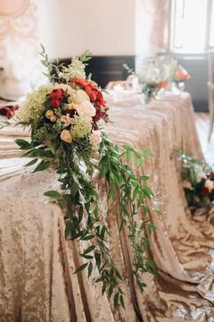 Wedding table decoration with flowers on the table in the castle, table decor 库存照片