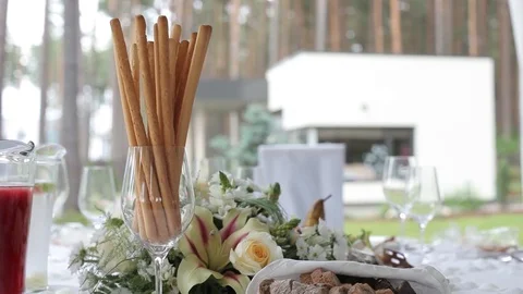 Wedding table in the garden decorations for the bride Bijouterie, ribbons, satin Stock Footage 95044304