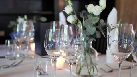 Wedding table people crossing with reflection in the wine glasses. Video stock 195121298