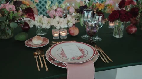 Wedding table place setting with plate cutlery candles and flowers Stock Footage 333111266