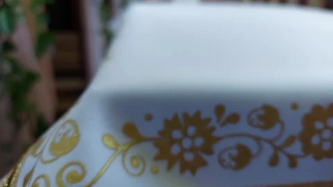 Wedding table runner with lace and gold embroidery inside a church aisle blur Stock Footage 336562525