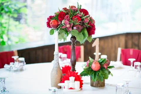 Wedding table set for fine dining or another catered event in red colors Stock Photos