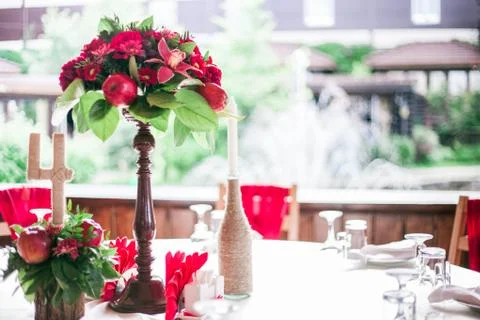 Wedding table set for fine dining or another catered event in red colors 库存照片