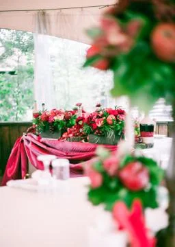 Wedding table set for fine dining or another catered event in red colors 写真素材