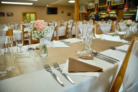 Wedding table setting with bistro lights. Stock Photos