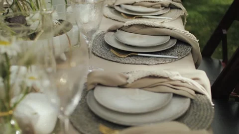 Wedding table setting, close-up of plates. Outdoor dining area showcasing Stock Footage 310249071