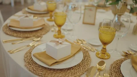 Wedding Table Setting With Gold Cutlery and Glassware Stock Footage 331493644