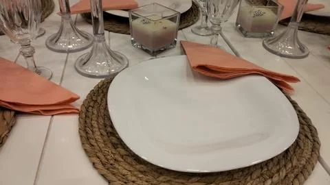Wedding table setting with plates, napkins and glasses. Stock Photos