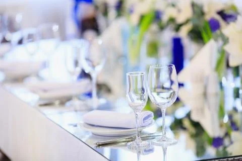 Wedding table setting in the restaurant on the white and blue background. Stock Photos