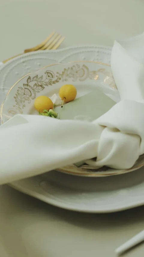 Wedding table setting with white plates, glasses and floral accents. Banquet Stock Footage 306156742