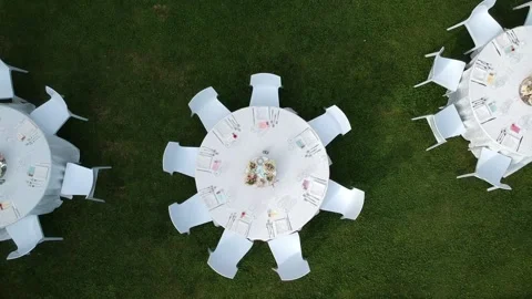 Wedding table, tables of a garten party filmed from above, camera moving upwards Stock Footage 178154225