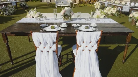 Wedding table for young merried couple with floral decoration on resort hyatt Stock Footage 101115771