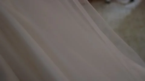 Wedding Train Drapes Softly With Graceful Motion, Sheer Layers Cascade Gently In Stock Footage 323772564