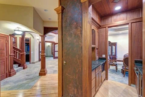Wedding venue interior features U-shaped wet bar with paneled walls and cabin Stock Photos