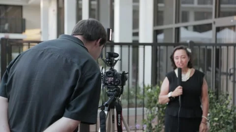 Wedding videographer interviewing lady Stock Footage 46061795