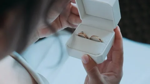 Wedding. Women's hands open a box with wedding rings Stock Footage 270892814