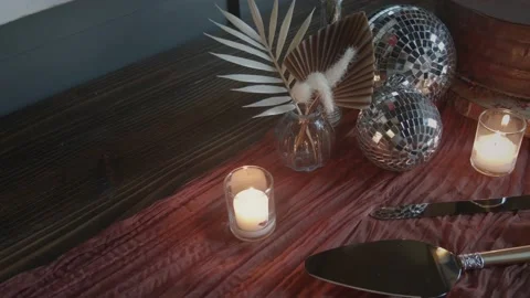 Wedding wooden table setting, still with glowing candles, tiny disco balls Stock Footage 218361842