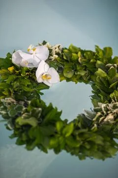Wedding wreath with orchids in the pool Stock Photos