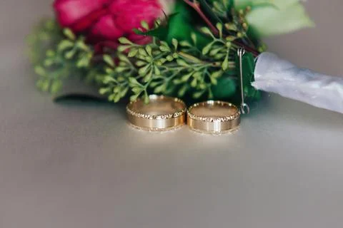 Weddings ring with the bunch of flower Stock Photos
