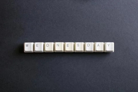 Wednesday word on computer keys button on a dark background. Foto stock