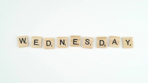 Wednesday Written In Scrabble Blocks. 4k Shot Of Hand Placing Wooden Game Stock Footage 156364564