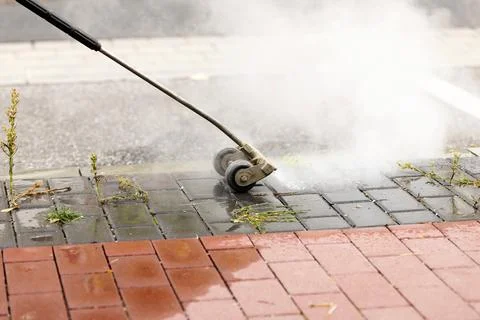 Weed control with a weed lance Stock Photos