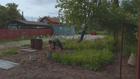 Weeding the ground, weeding the soil Video stock 336372370