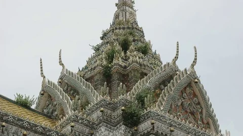 Weeds growing on an outer prang of wat arun temple in bangkok Stock Footage 79911953