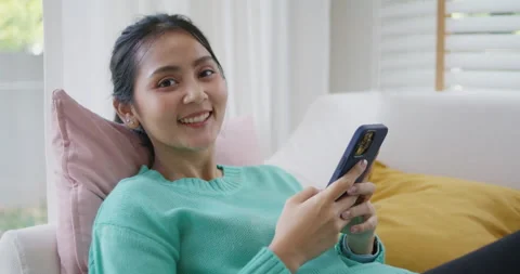 Weekend activity lying back resting on easy cozy sofa couch at home. 動画素材 191540383