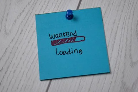 Weekend Loading write on sticky note isolated on wooden table. Stock Photos