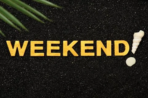 Weekend - Single word in black sand Stock Photos