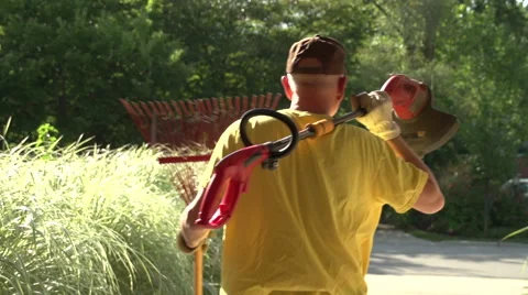 Weekend Warrior, Man Getting Ready to do Yard Work in the Summer Video stock 44815468