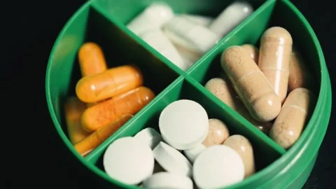 Weekly pills box is designed for efficient storage of dietary supplements and Stock Footage 322169749