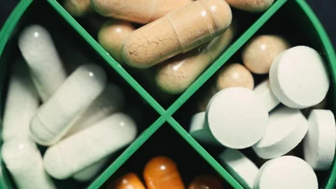 Weekly pills box is designed for efficient storage of dietary supplements and Stock Footage 330240936