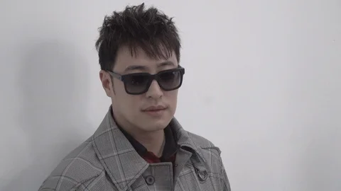 Weibo Pan posing for photographers at the Lanvin show during Paris fashion Stock Footage 97184045