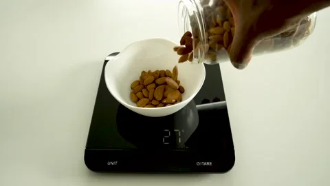 Weigh almonds Stock Footage 247322344