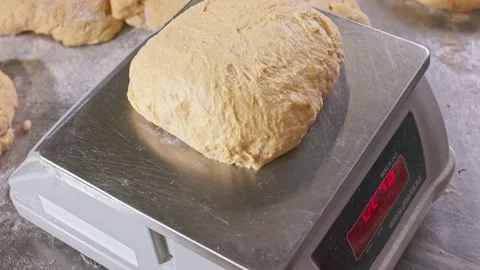 Weigh the dough to bake the bread Stock Footage 155522867