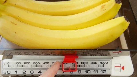 Weighing bananas on a scale. Stock Footage 246729629