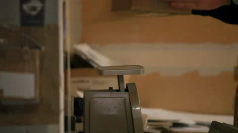 Weighing a box for shipping Stock Footage 24521837