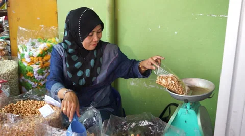 Weighing Up Dried Cashew Nuts In Pengkalan Kubur Market at Kelantan, Malaysia Stock Footage 34630972