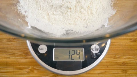 Weighing Flour with a Digital Kitchen Scale - 4k Stock Footage 102466536