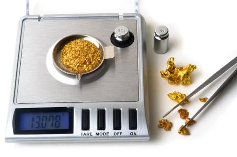 Weighing of gold Stock Photos
