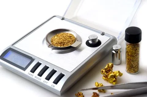 Weighing of gold Stock Photos