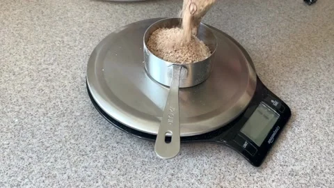 Weighing Ingredients to Bake Bread at Home Stock Footage 134183513
