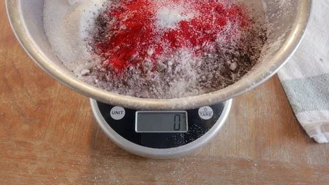 Weighing Ingredients on a Digital Kitchen Scale to Bake a Red Velvet Cake - 4K Stock Footage 76585074