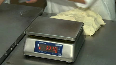 Weighing a portion of the test on an electronic scale Stock Footage 99614102