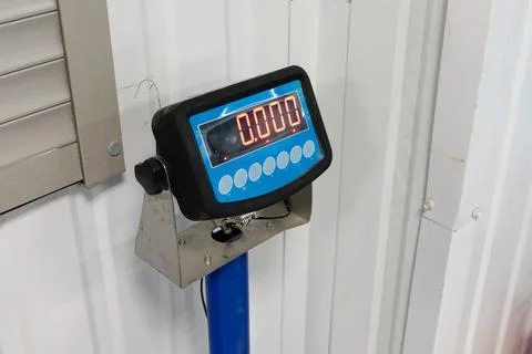 Weighing scale displaying zero at a storage facility Stock Photos