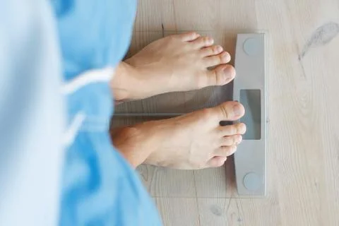 Weighing on scale Stock Photos
