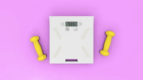 Weighing scale with two yellow dumbbells on the cyan blue flat layer background Stock Footage 158662013